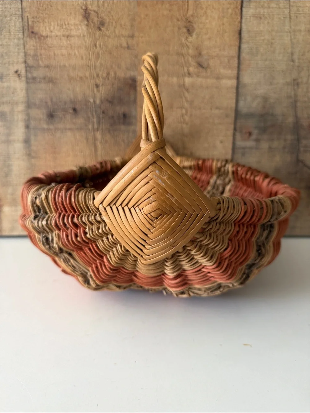 Vintage Primitive Woven Buttocks Basket with God’s Eye in Natural and Terracotta